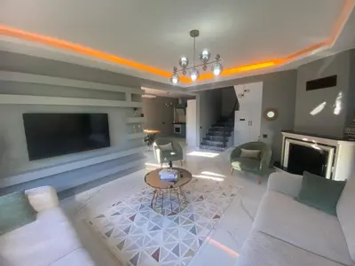 a living room with a couch and chairs and a tv at Lina Garden Villa in Sapanca