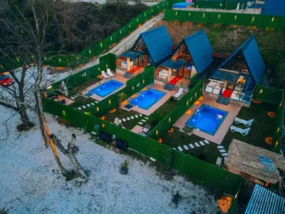 an aerial view of a house with two swimming pools at Mert Bungalov-Ay Evi in Sapanca