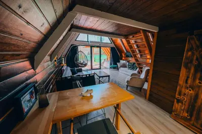 a small room with a table and a couch at Mert Bungalov-Ay Evi in Sapanca