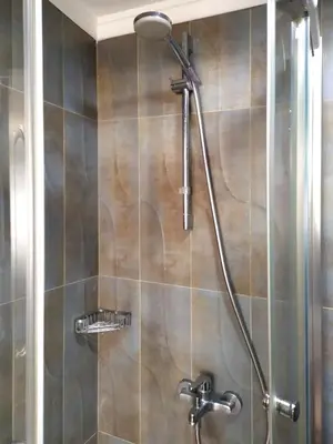 a shower with a shower head in a bathroom at ELİTE HOTEL By MK in Istanbul