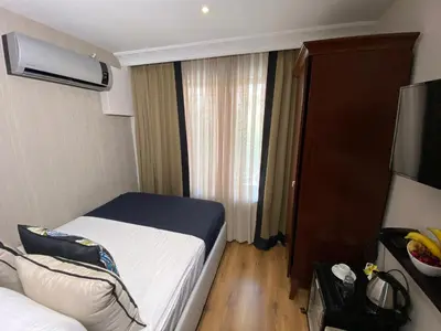 a hotel room with a bed and a window at Four Doors Hotel in Istanbul
