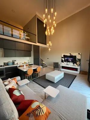 a living room with a couch and a table at Loft Sabırlı in Kaynarca