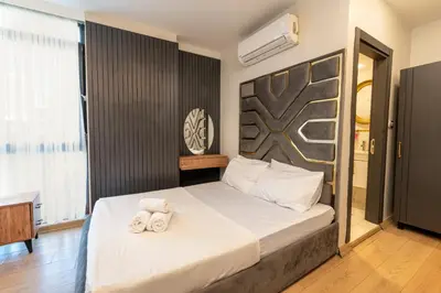 a bedroom with a bed with two towels on it at Highway 34 Hotel in Istanbul