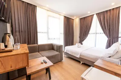 a hotel room with a bed and a couch at Highway 34 Hotel in Istanbul
