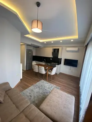 a living room with a couch and a table at Şişli Merkezde Konforlu Daire in Istanbul