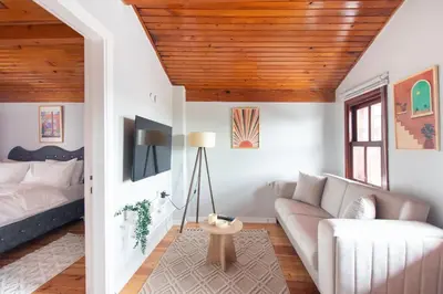 a living room with a couch and wooden ceilings at Historic 4BR 4BA Mansion Seaview Yedikule Old Town in Istanbul