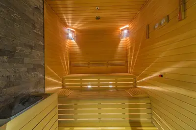 a wooden sauna with two benches in a room at Naz City Hotel Taksim - Special Category in Istanbul
