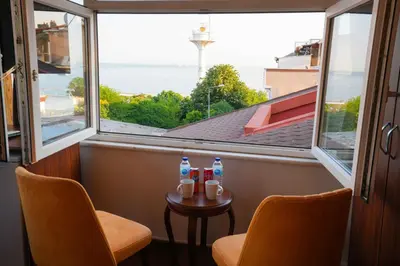 a room with two chairs and a table with water bottles on it at Violin Hotel Sultanahmet in Istanbul