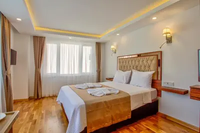 a hotel room with a bed with towels on it at Violin Hotel Sultanahmet in Istanbul