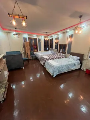 a large room with two beds in it at Müstakil kat 2 in Istanbul