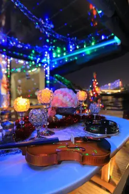 a table with christmas lights and candles on it at Den Den İstanbul in Istanbul