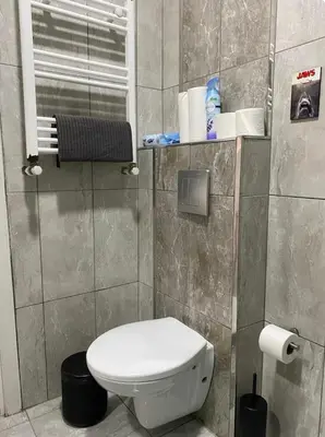 a small bathroom with a toilet and a window at K&Y Taksim Rooftop in Istanbul
