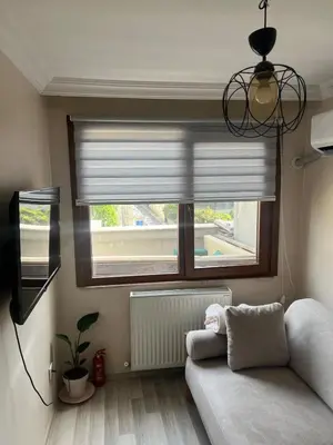a living room with a couch and a window at K&Y Taksim Rooftop in Istanbul