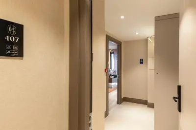 a hallway with a door to a bathroom at Emilion Hotel in Istanbul
