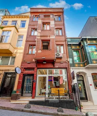 a tall building on a city street at Brk Dream Suites Taksim in Istanbul