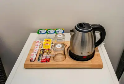 a coffee maker on a cutting board on a table at Brk Dream Suites Taksim in Istanbul