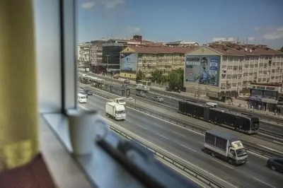 a view from a window of a highway with trucks at Istanbul Fair Hotel in Istanbul