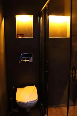 a small bathroom with a toilet and a shower at Istanbul Fair Hotel in Istanbul