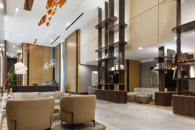 a lobby of a hotel with couches and chairs at Marriott Executive Apartments Istanbul Investvadi in Istanbul
