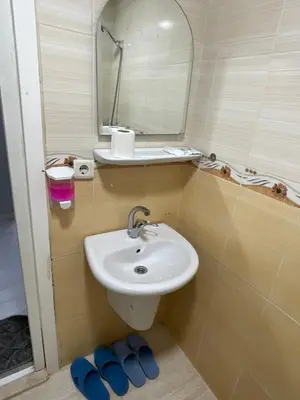 a bathroom with a sink and a mirror at Hotel Grand Ömer in Istanbul
