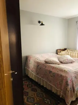 a bedroom with a bed with a pink blanket at Polonezköy butik bahçeli ev in Beykoz
