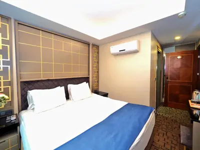 a bedroom with a large bed in a room at Grand Best Nobel Hotel İstanbul in Istanbul