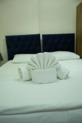 a bed with two towels on top of it at BDK hotel in Istanbul