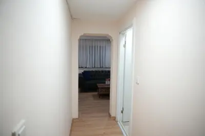 a hallway with a living room with a blue couch at BDK hotel in Istanbul