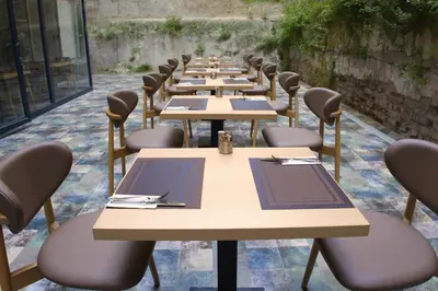 a row of tables and chairs in a restaurant at The Galata Glory Hotel in Istanbul