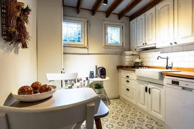 a kitchen with a bowl of fruit on a table at Historic Balat 2BD2Bath Central House! #388 in Istanbul