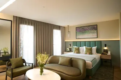 a hotel room with a bed and a couch at The Wings Hotels Pera in Istanbul