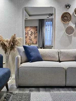 a living room with a couch and a mirror at Excellent Apartments Pierre Loti in Istanbul