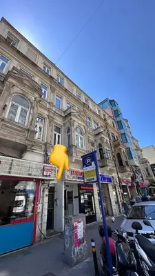 a building on a city street with a yellow object at Echoloft İstanbul- Nişantaşı in Istanbul