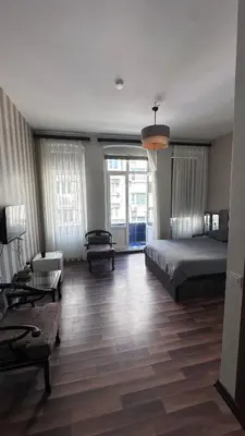 a bedroom with a bed and a large window at Echoloft İstanbul- Nişantaşı in Istanbul