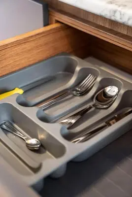 a kitchen sink with silver utensils in it at House with balcony in Galata 2 in Istanbul