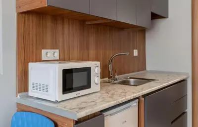 a kitchen with a microwave and a sink at House with balcony in Galata 2 in Istanbul