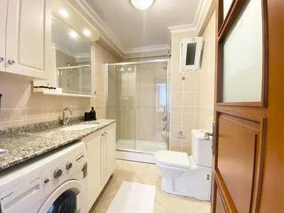 a white bathroom with a toilet and a shower at Near Nişantasi & Stylish No1 in Istanbul