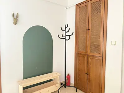 a room with a tv and a stand next to a cabinet at Near Nişantasi & Stylish No1 in Istanbul