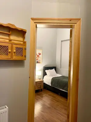 a bedroom with a bed and a mirror at Soil balat in Istanbul