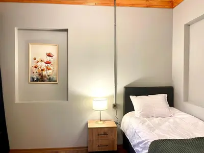 a bedroom with a bed and a table with a lamp at Soil balat in Istanbul