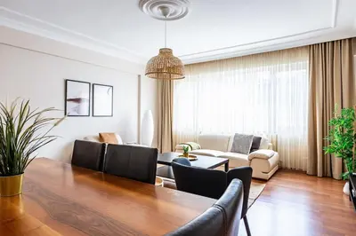 a living room with a table and a couch at Gorgeous 3 Bedroom Flat - No8 in Istanbul