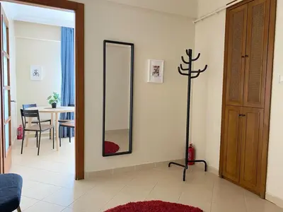 a living room with a mirror and a table at City Center Spacious Flat No9 in Istanbul