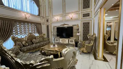 a living room filled with furniture and a flat screen tv at Luxury Skylights Villa in Kullar