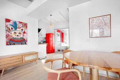 a living room with a wooden table and chairs at Roof top, close to Taksim, with private terrace in Istanbul