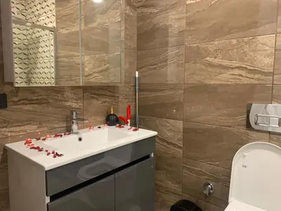 a bathroom with a sink and a toilet at Luxury Rezidans in Istanbul
