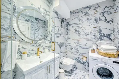 a bathroom with a sink and a washing machine at Bright Apart Hotel in Istanbul