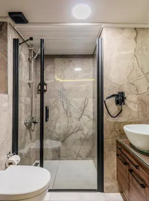 a bathroom with a shower and a toilet and a sink at Felix Hotel in Istanbul