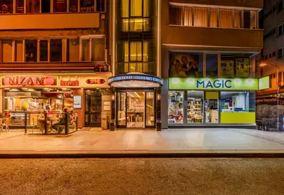 an empty street in a city at night at Felix Hotel in Istanbul