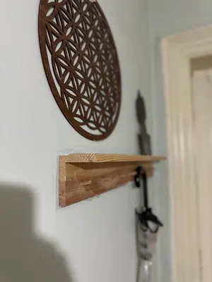 a wooden object is hanging on a wall at Hostel Nelly in Istanbul