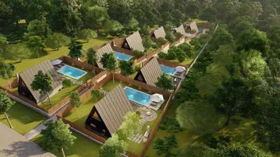 an overhead view of a house with swimming pools at Redka Bungalov Resort in Ulupelit